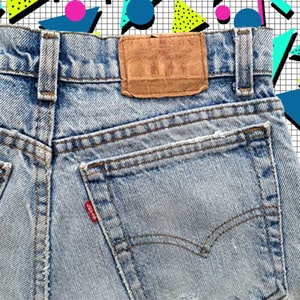 80s pair of jeans Levi's on an 80s pattern background